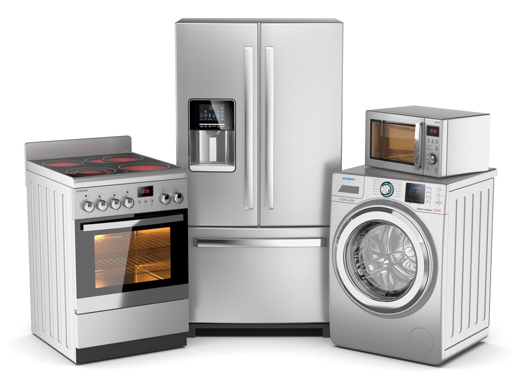 Modern stainless steel kitchen and laundry appliances including a refrigerator, electric stove, front-load washing machine, and microwave oven.